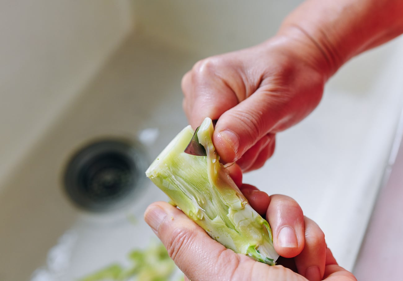 peeling broccoli stems with paring knife