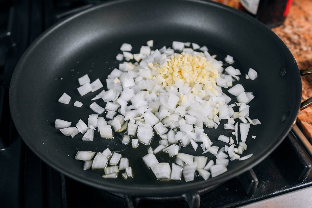 onion and garlic in pan cooking