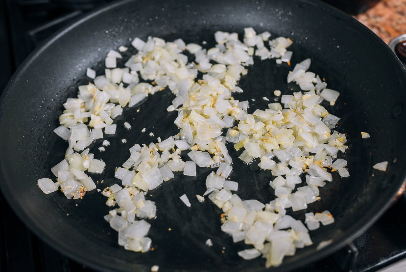 cooking onion and garlic in pan