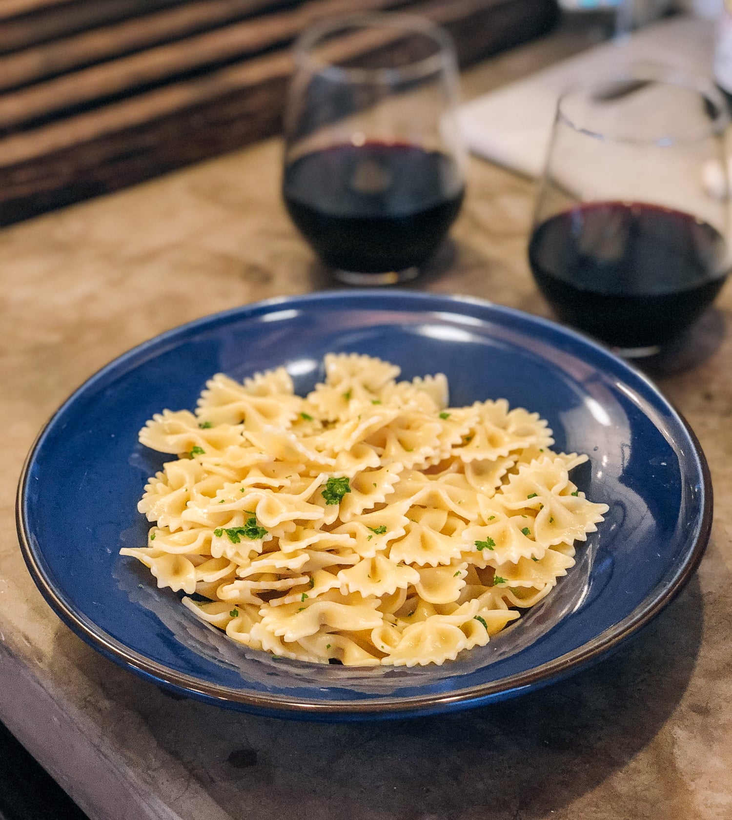 plate of buttered bow-tie pasta
