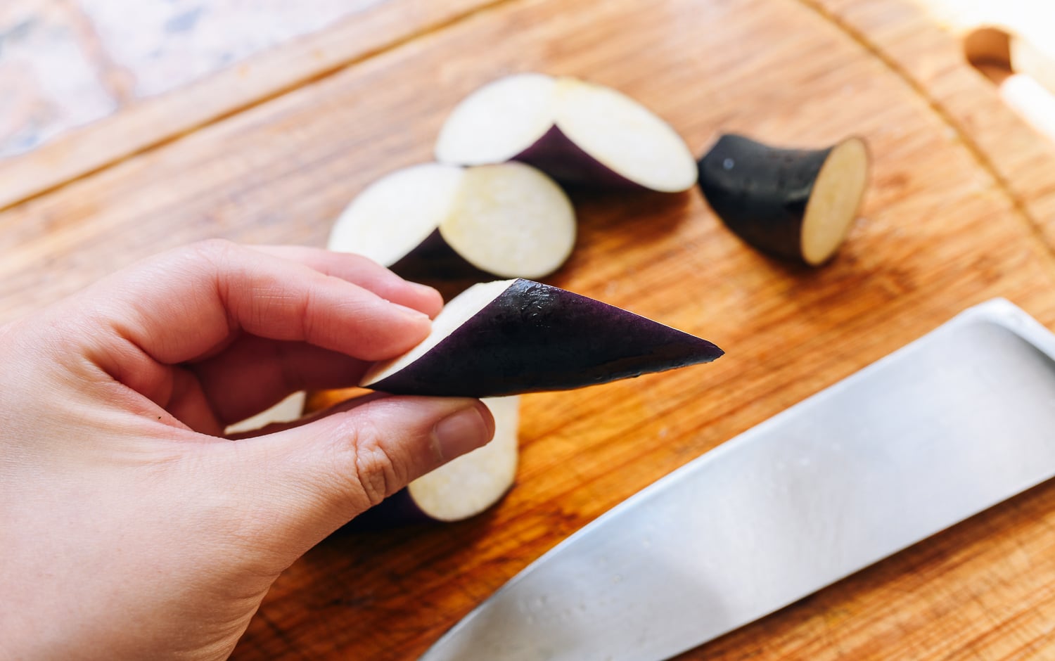 chinese eggplant cut into bite-size triangular pieces