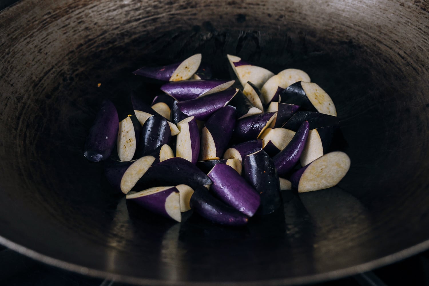 searing eggplant in wok