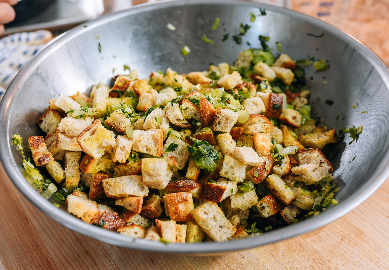 bread cubes mixed with vegetable and herb mixture for stuffing