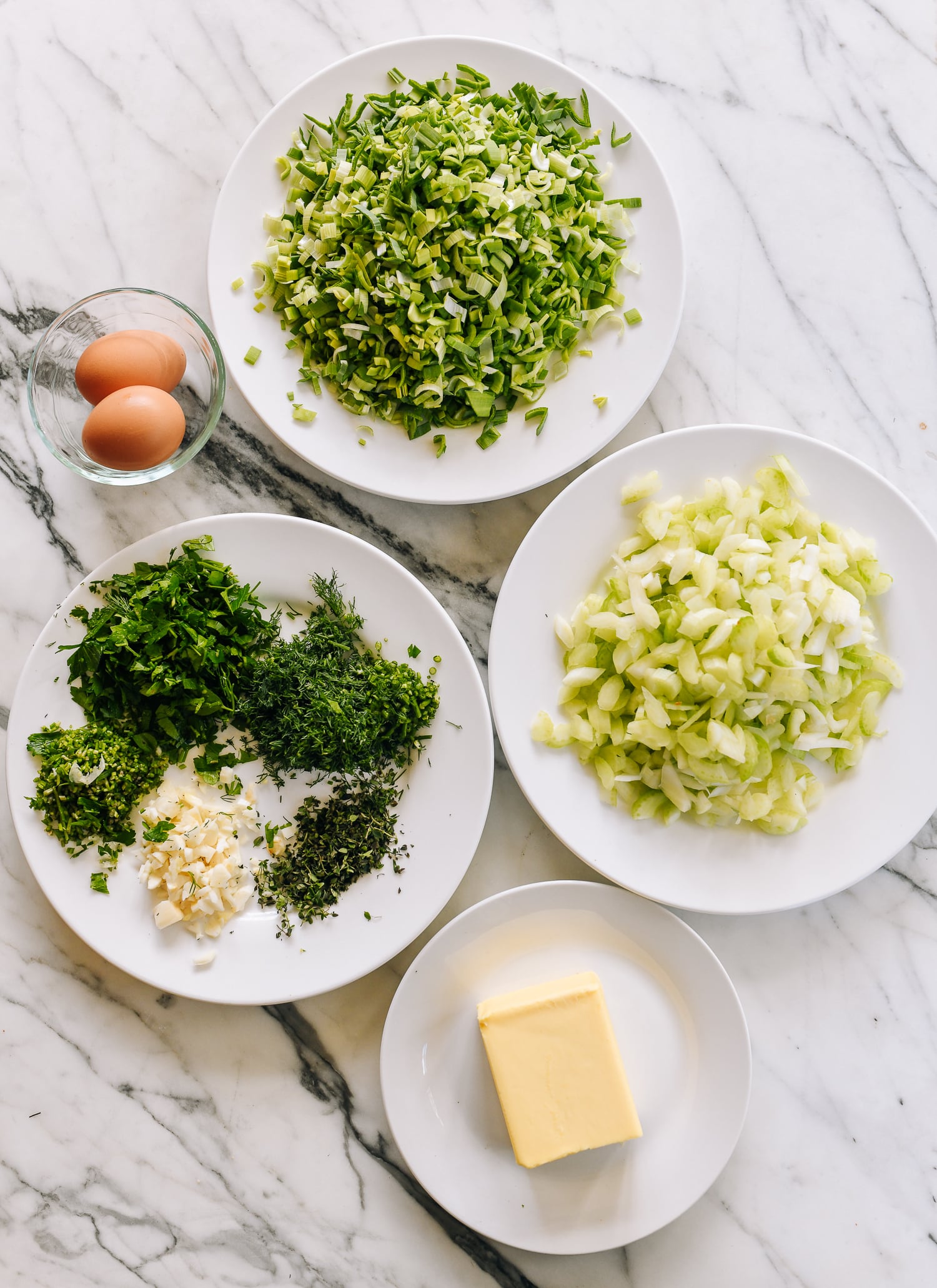chopped vegetables and herbs for herb stuffing, with eggs and butter