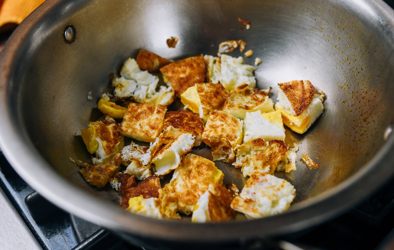 bite size pieces of fried egg in pot