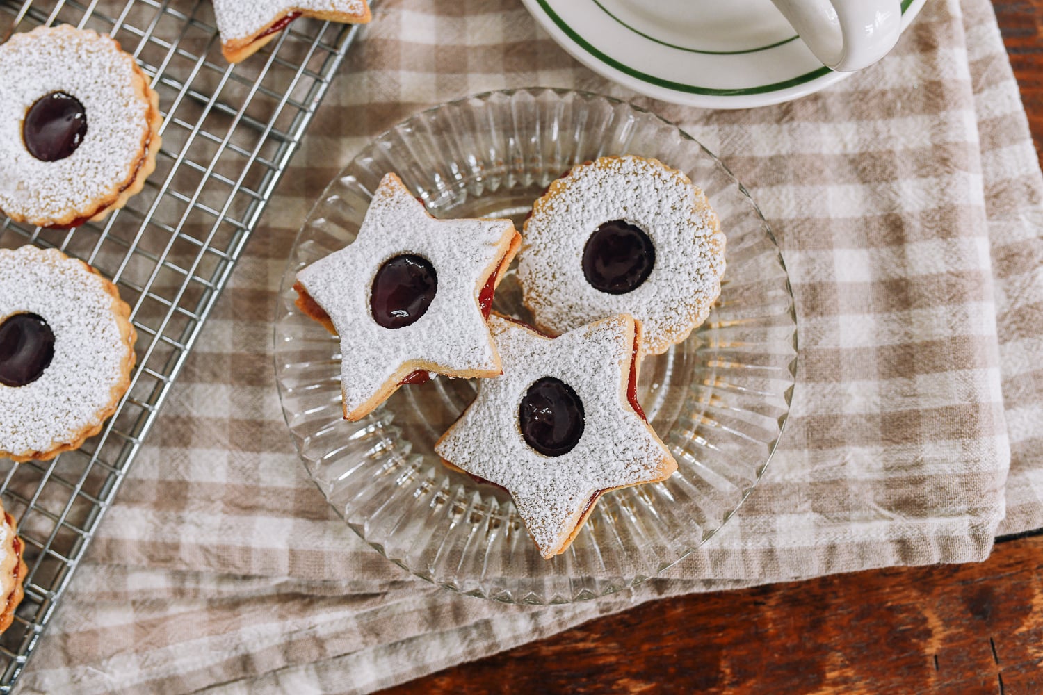linzer cookies on glass plate
