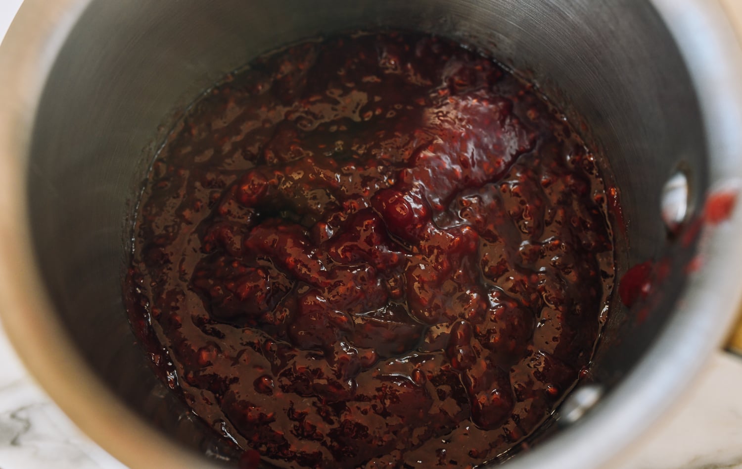 raspberry jam in small pot