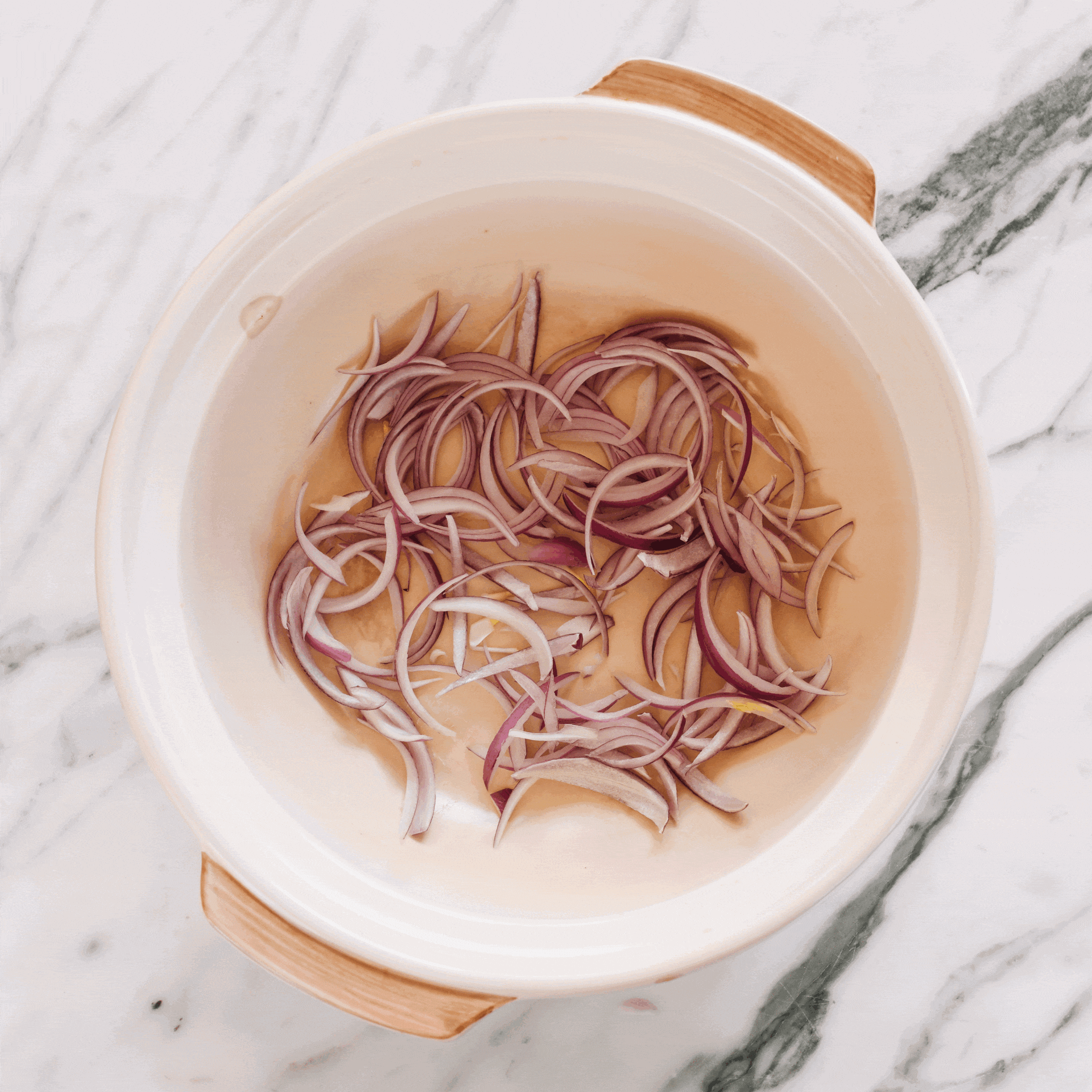 Layering ingredients in shrimp clay pot