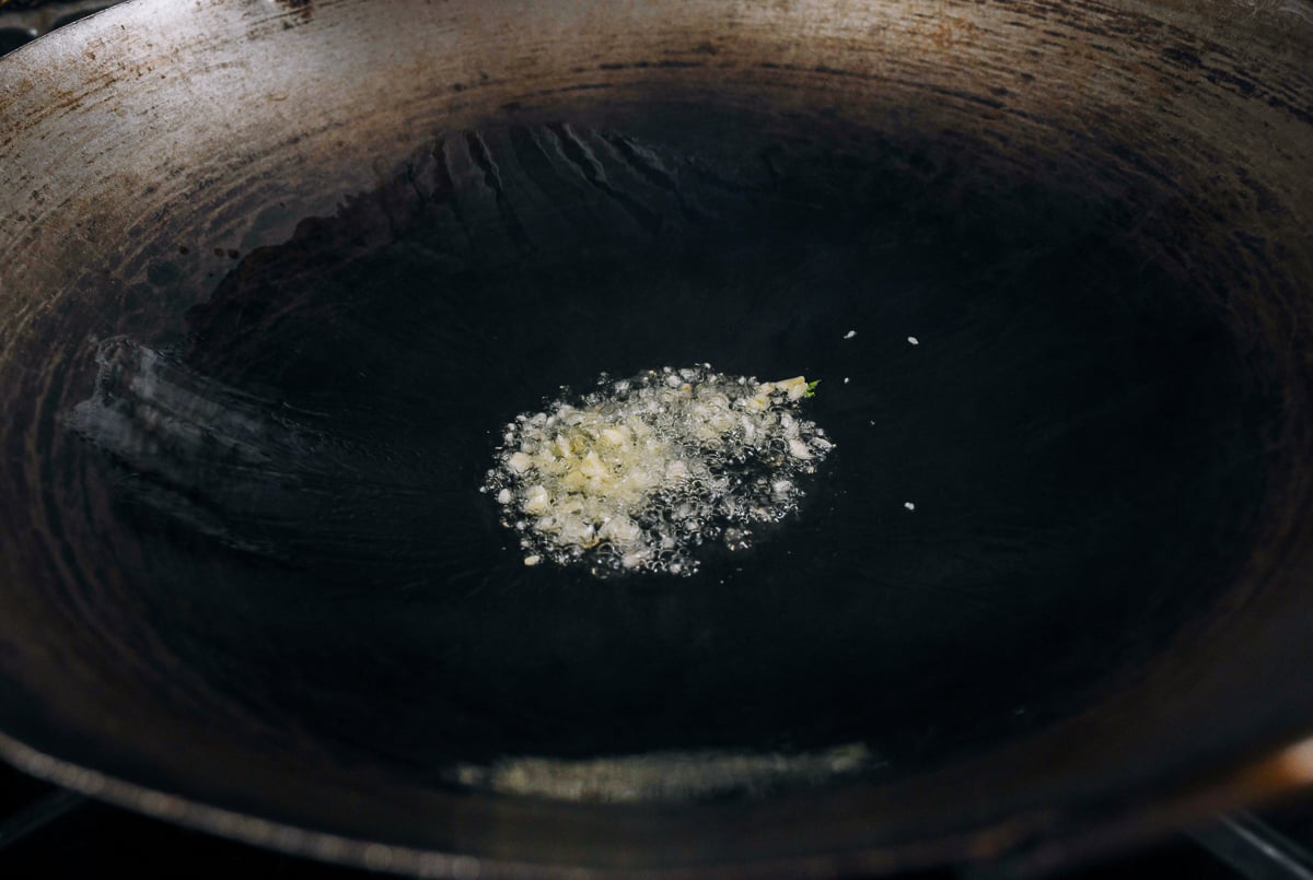 garlic in wok with oil