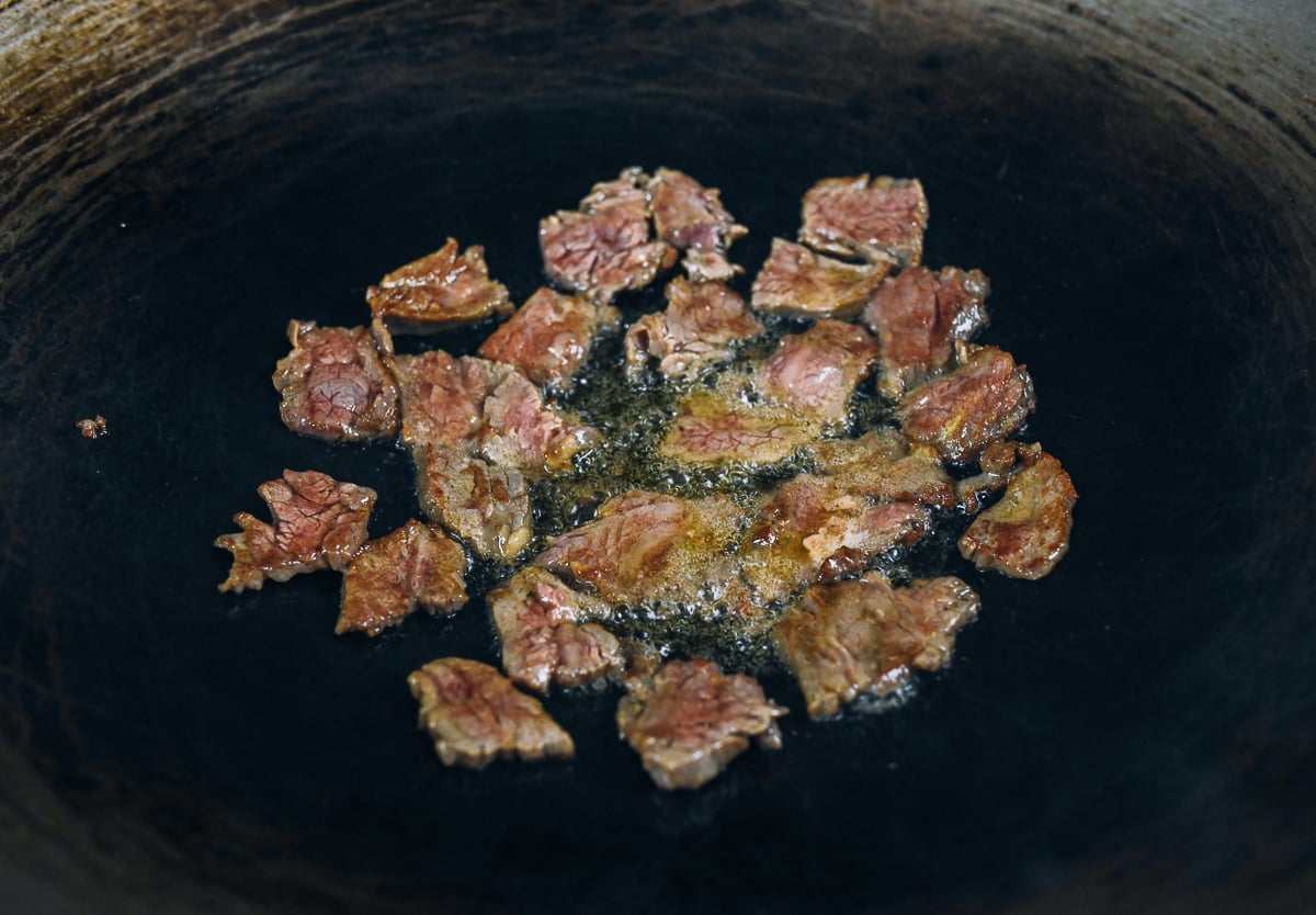 seared flank steak in wok