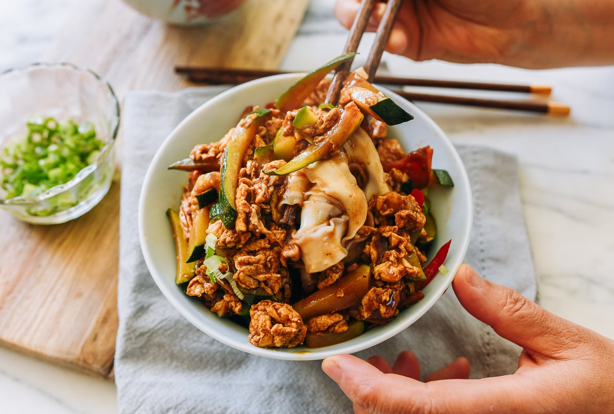 mixing braised egg with noodles