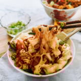 mixing braised egg noodles with chopsticks