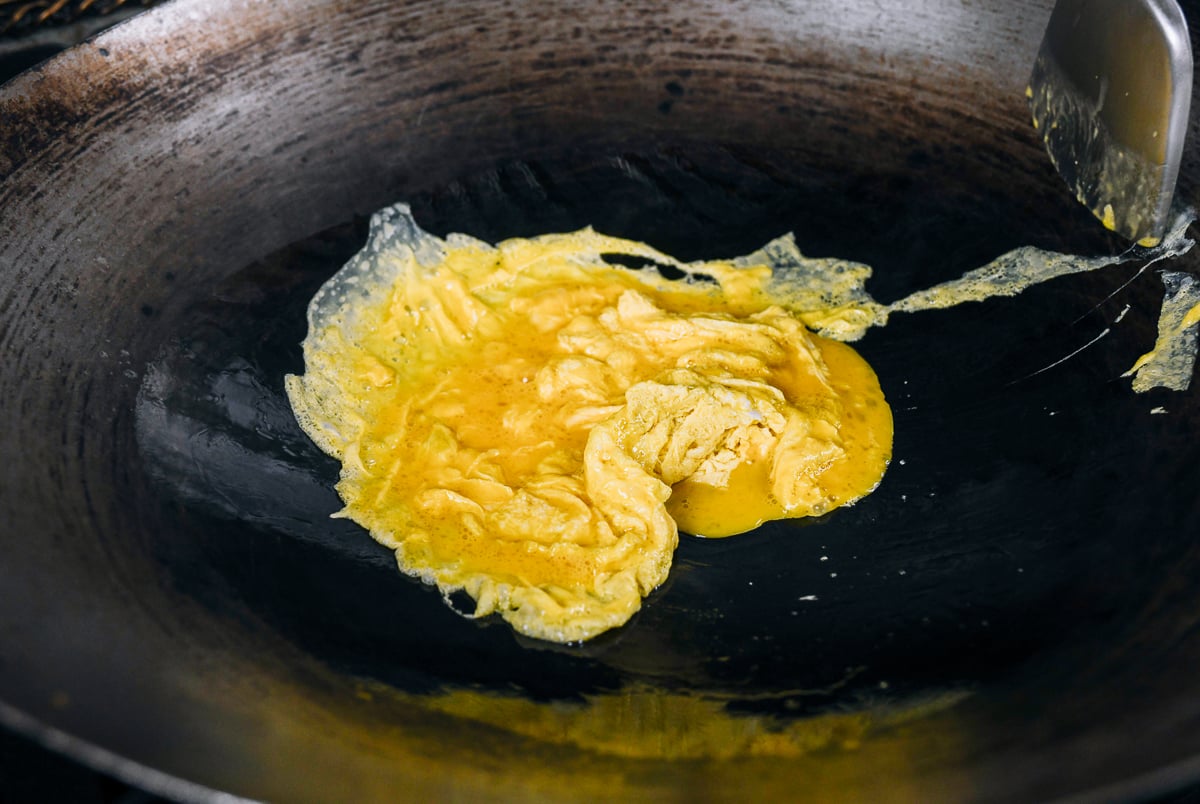 scrambling eggs in a wok