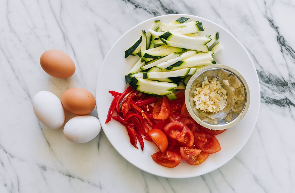 zucchini, chili, tomato, garlic, and eggs