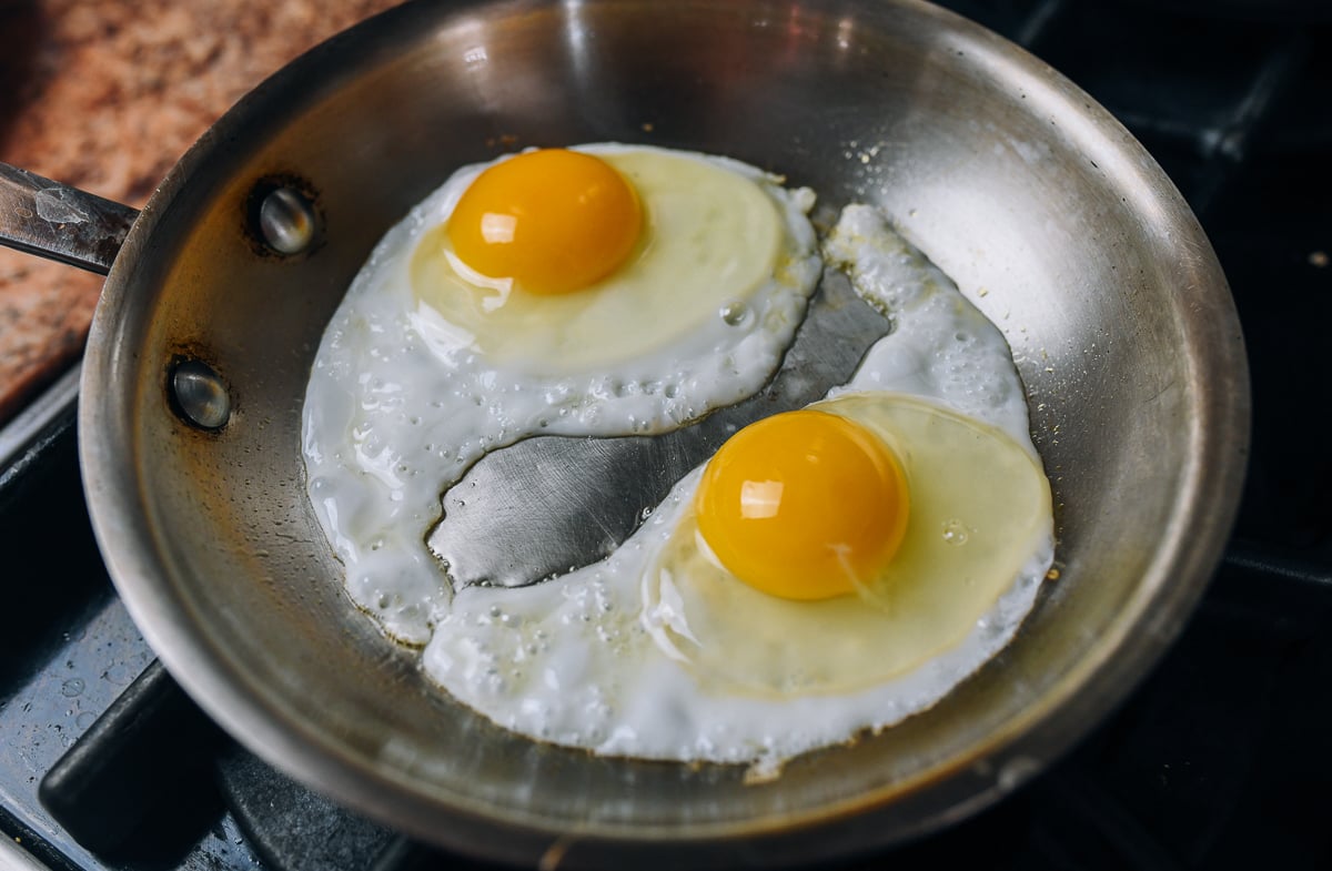 frying eggs in pan