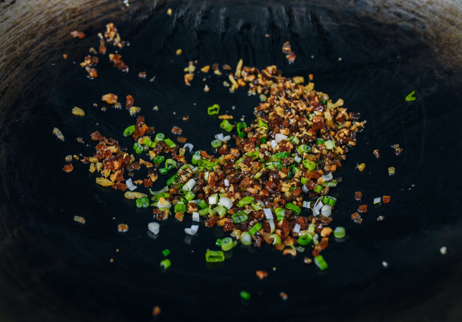 chopped scallions added to shrimp, mushrooms, and chinese sausage