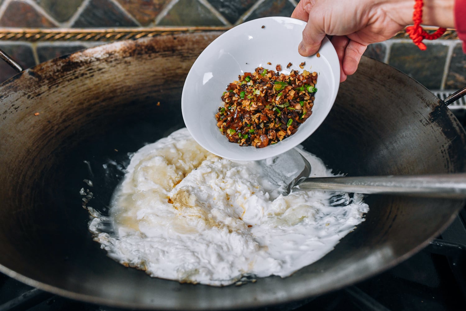 adding cooked shrimp, mushrooms, sausage, and scallions to lo bak go batter