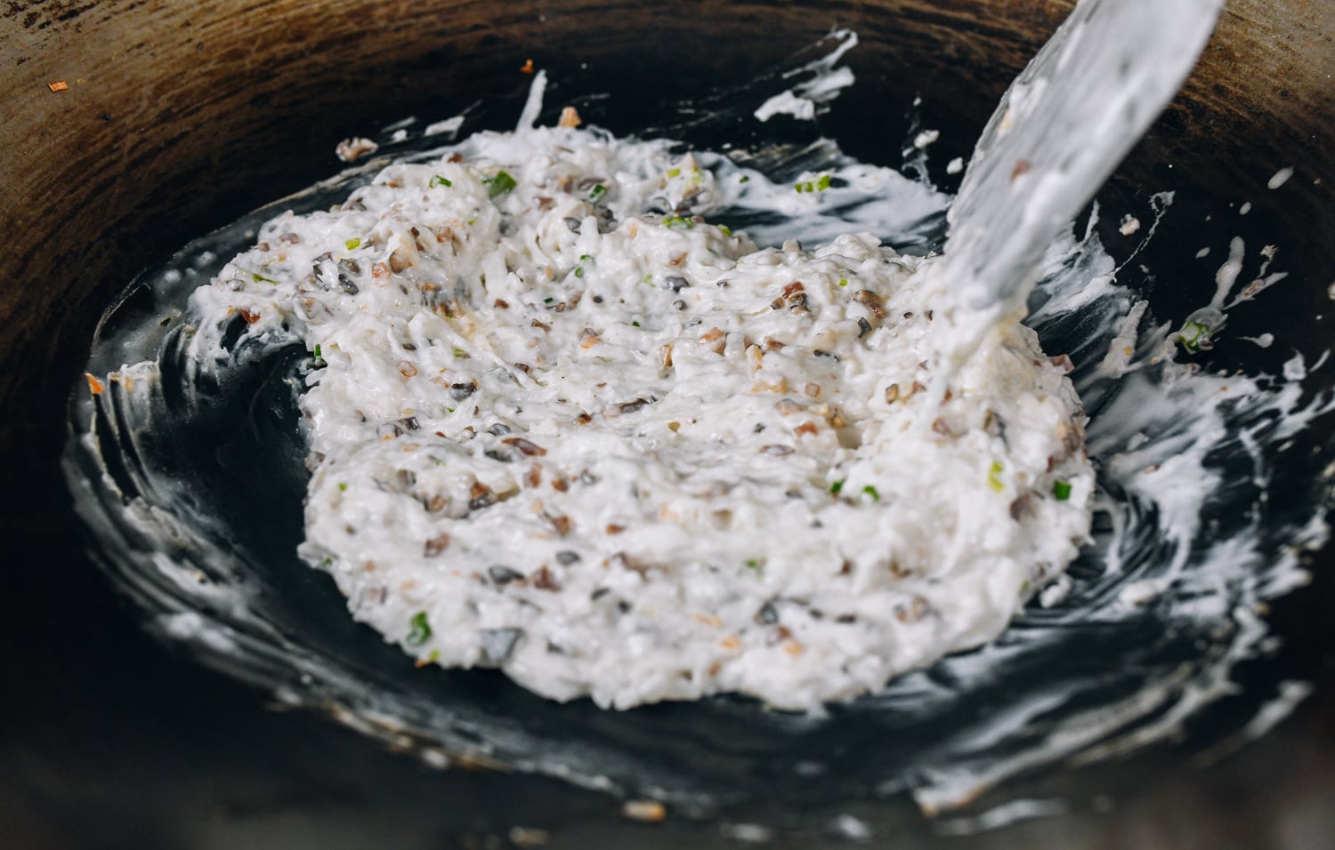 stirring batter for Chinese radish cake