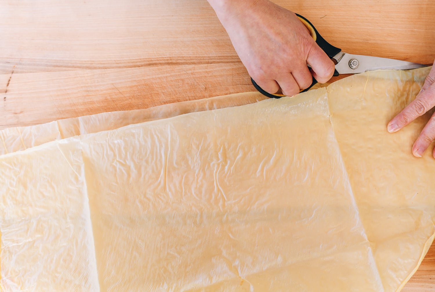 cutting bean curd skin sheet in half