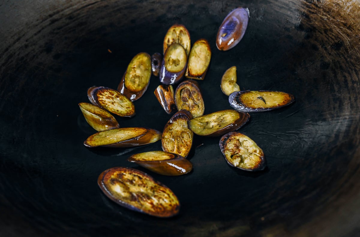seared slices of Chinese eggplant in wok