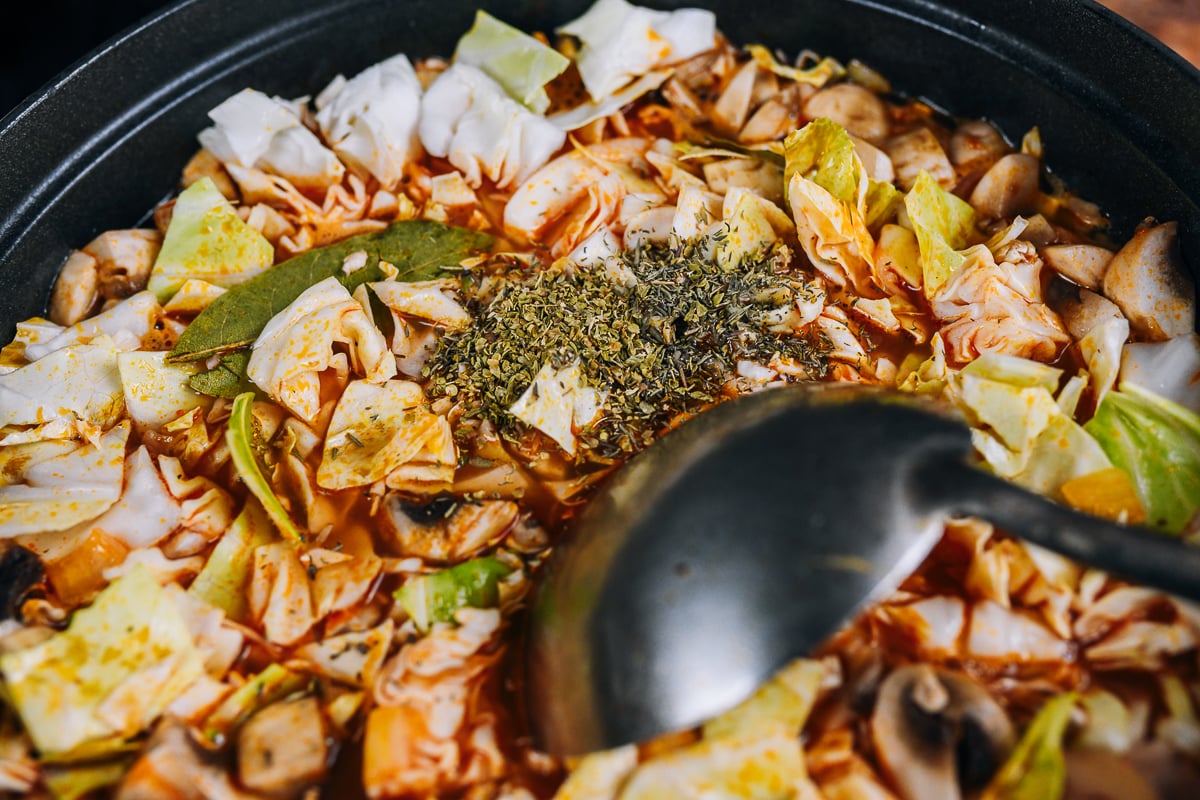bay leaves and thyme added to vegetable soup