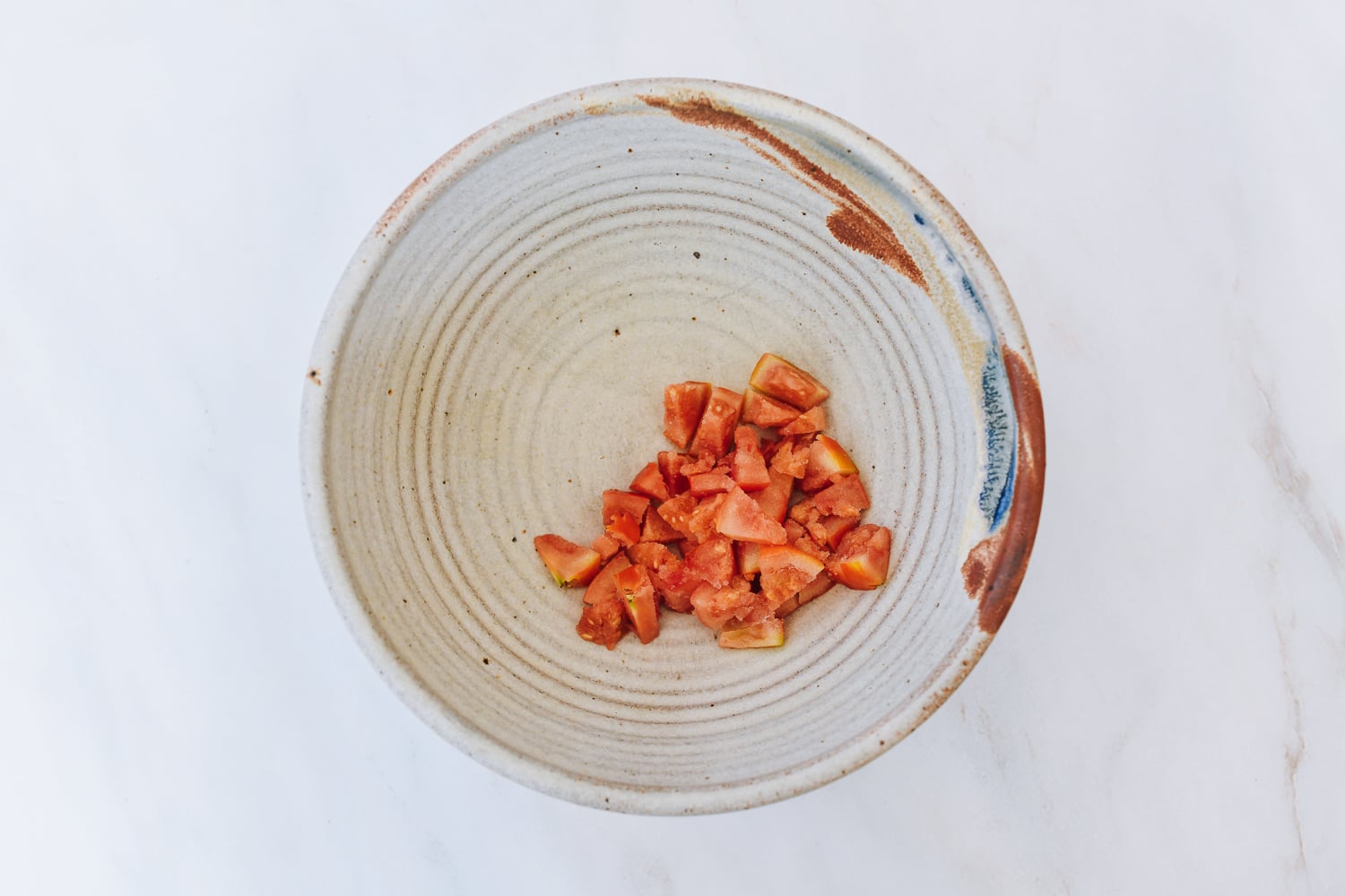 chopped tomato in bowl