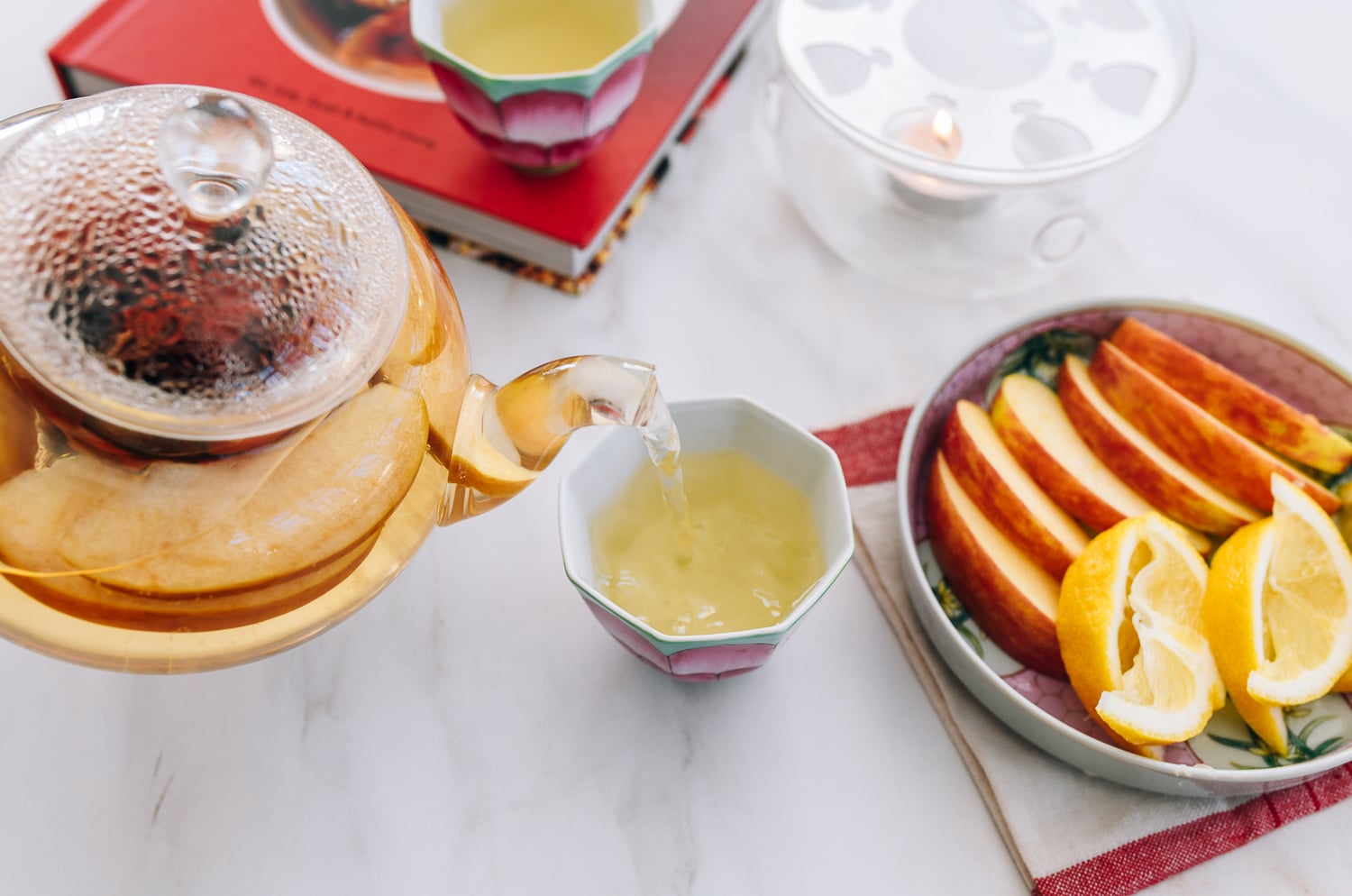 pouring tea into cup