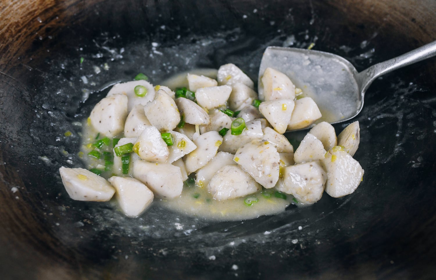 stirring taro stir-fry with scallion