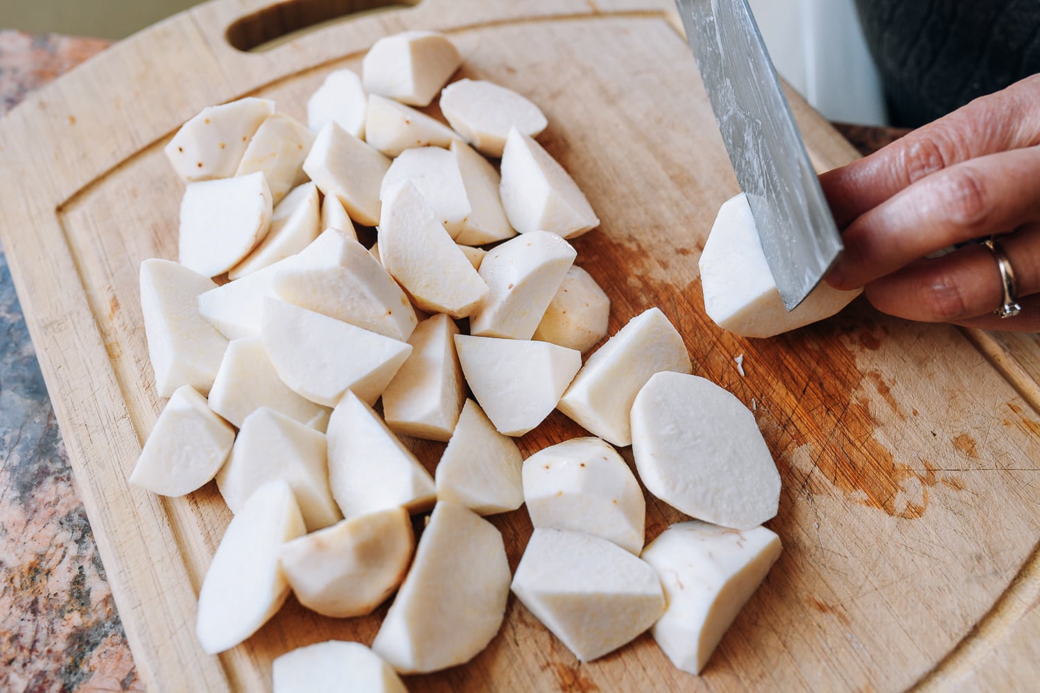 cutting chunks of taro