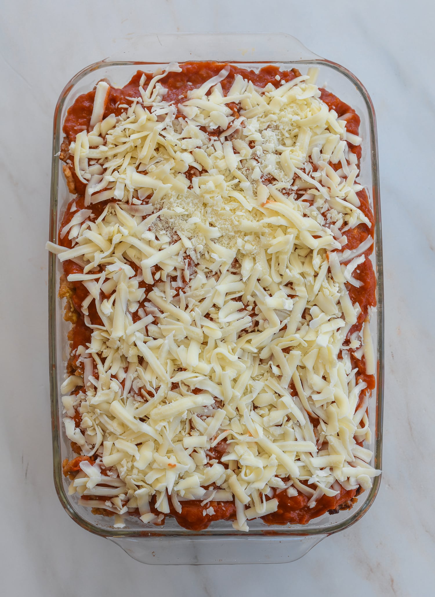 shredded cheese on pork chop rice