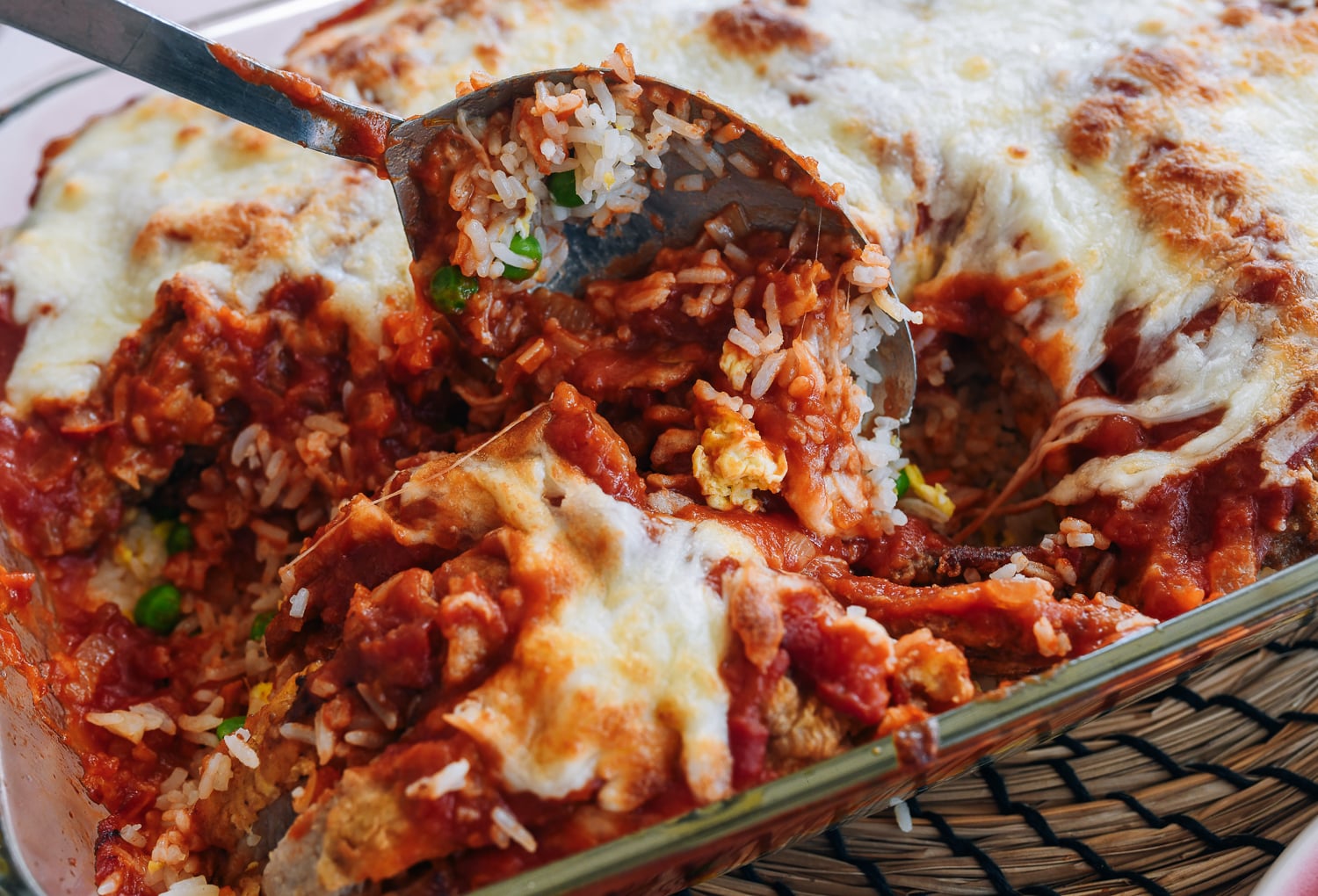 Scooping baked pork chop rice