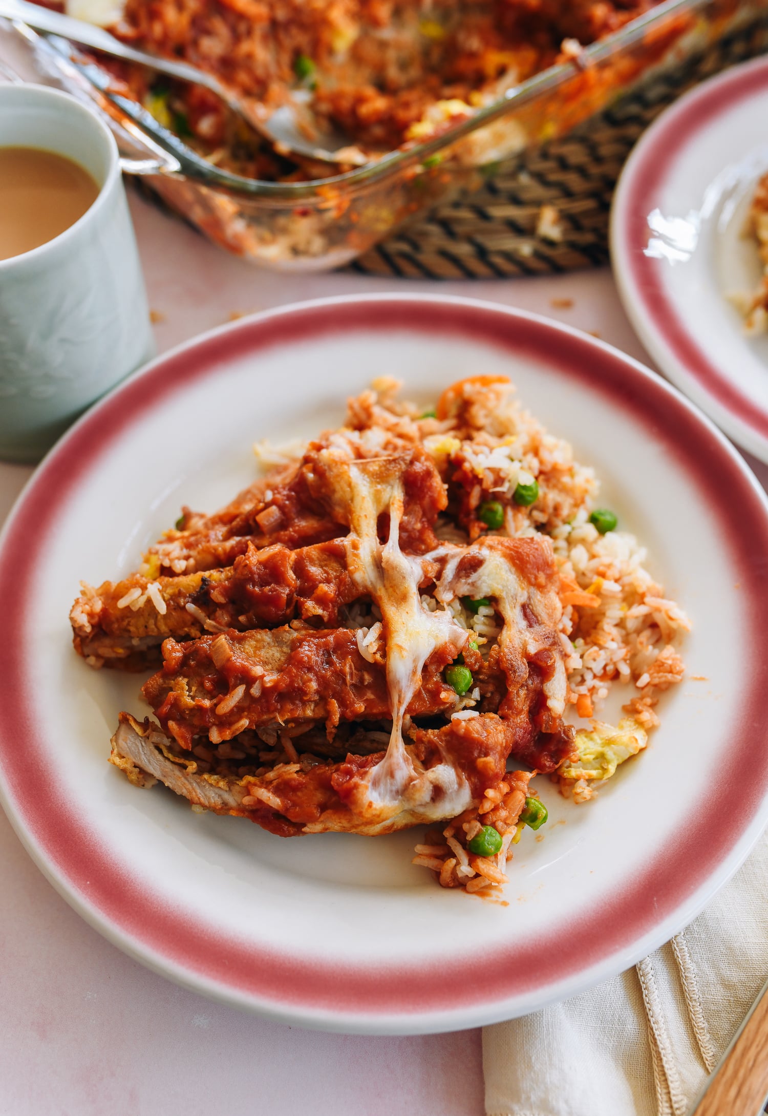 Baked Pork Chop Rice with cheese, tomato ssauce, and egg fried rice