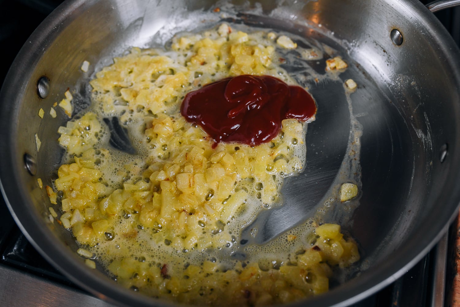 ketchup added to onions and flour roux