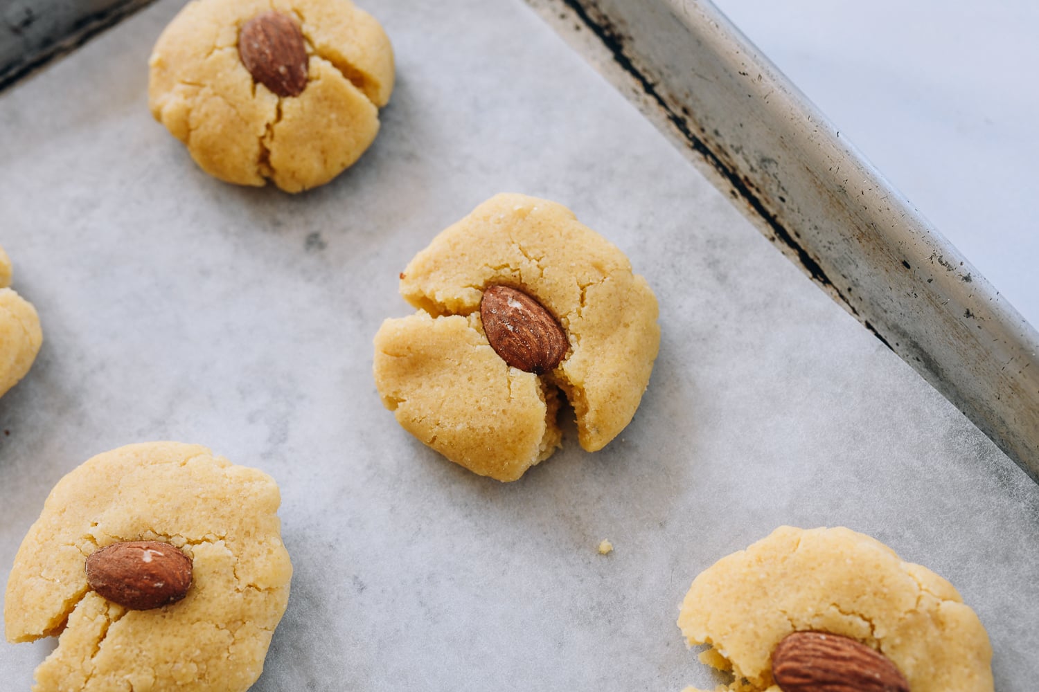 cracked almond cookie before baking