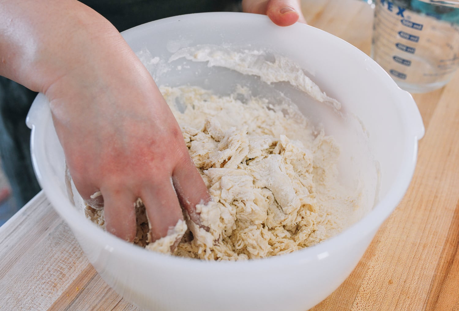 mixing all-purpose flour and water into scraggly dough