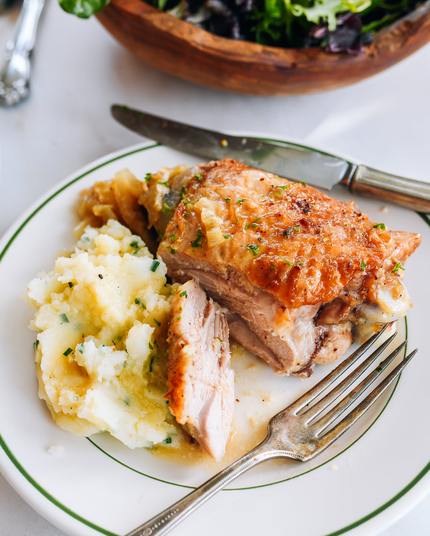 cutting into roasted turkey thigh