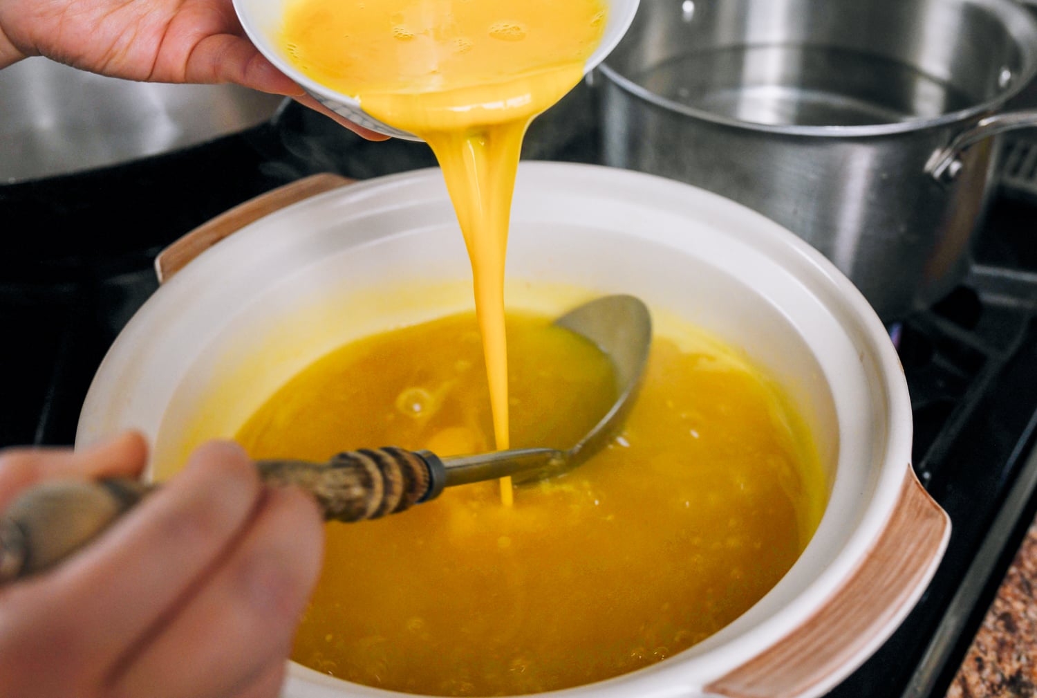 stirring egg into soup