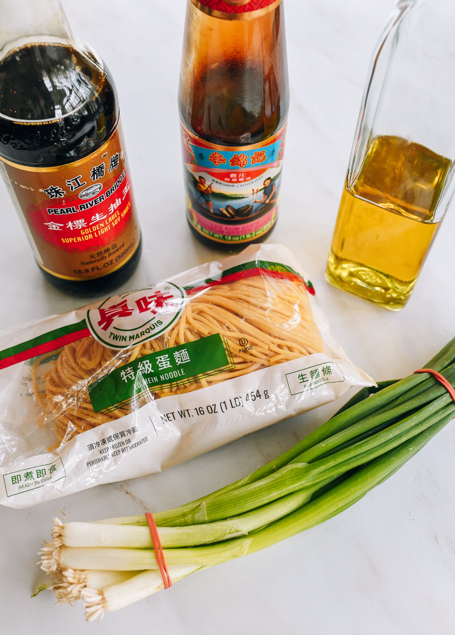 soy sauce, oyster sauce, oil, lo mein noodles, and scallions