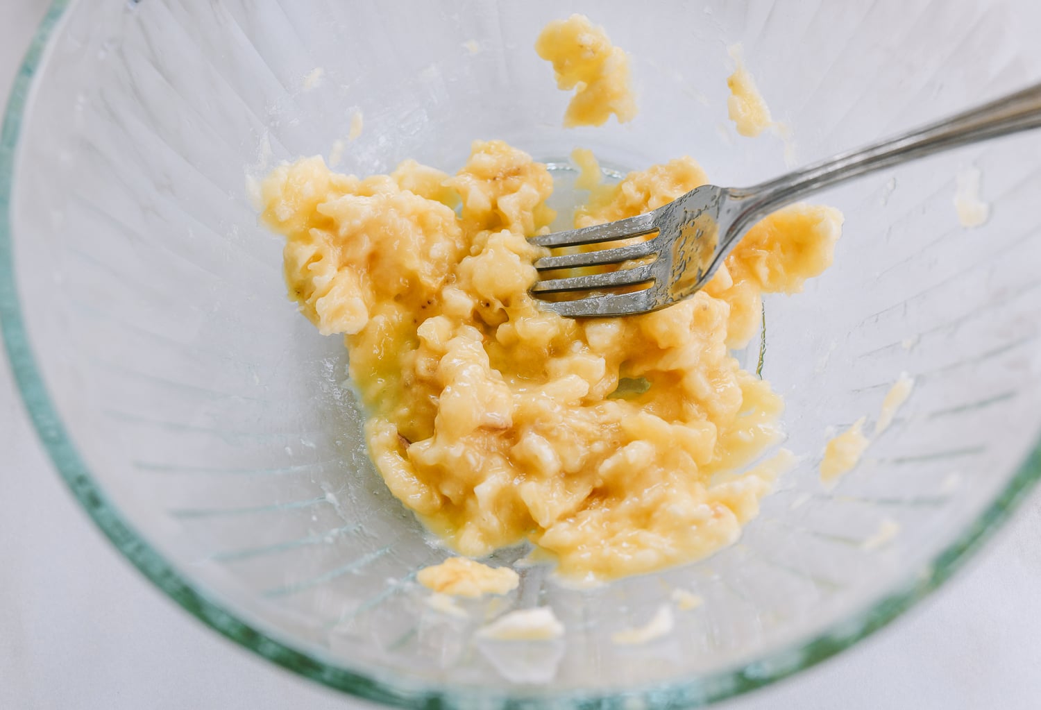 mashing banana with fork