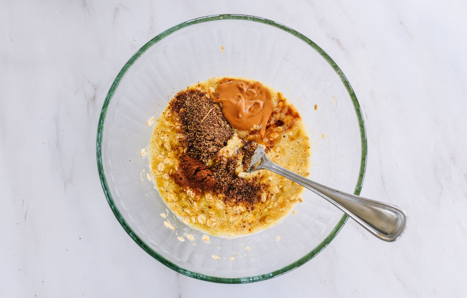 adding nut butter, flaxseed meal, cinnamon to banana oat pancake batter