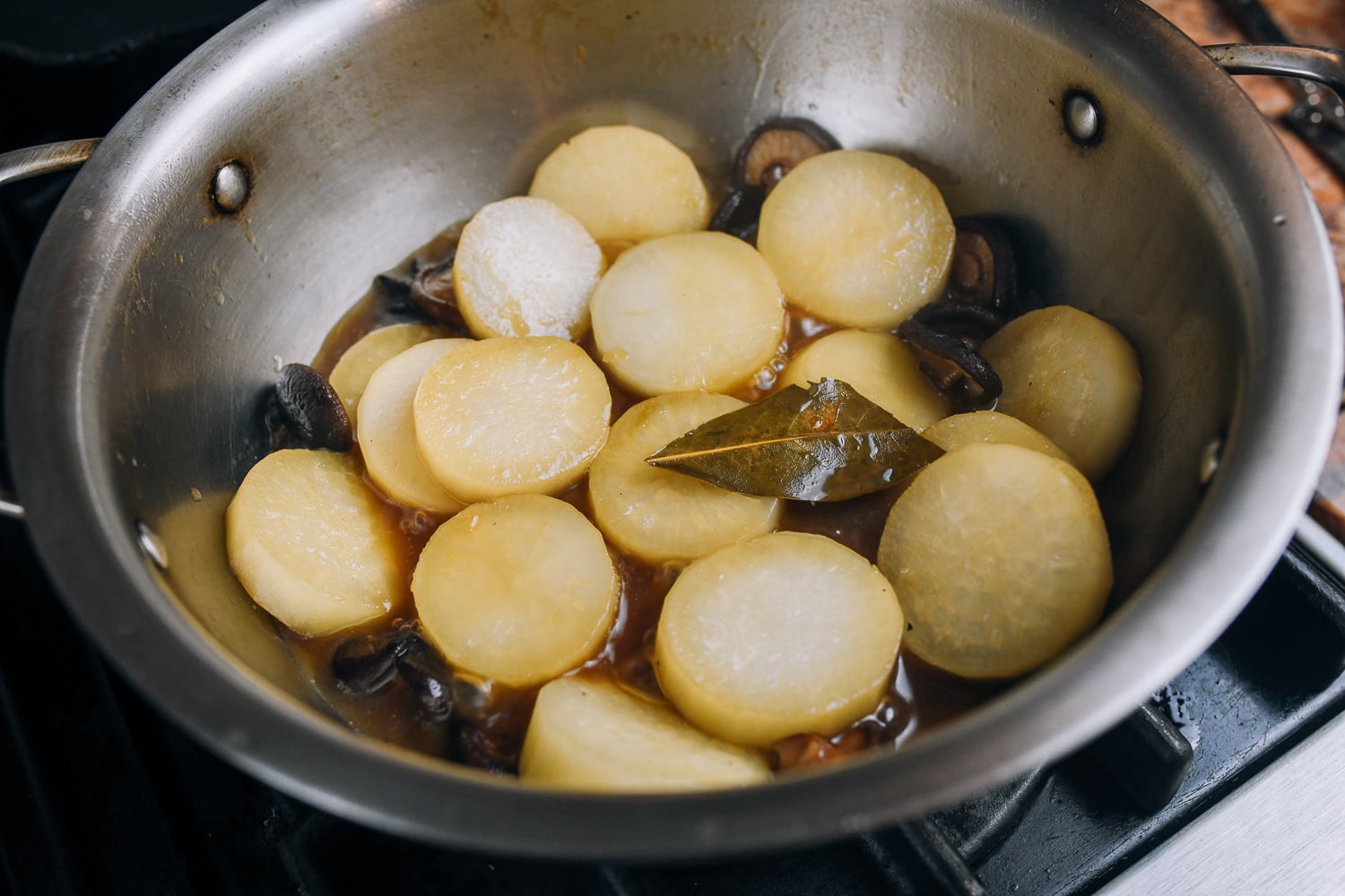 braising daikon radish with aromatics and mushrooms