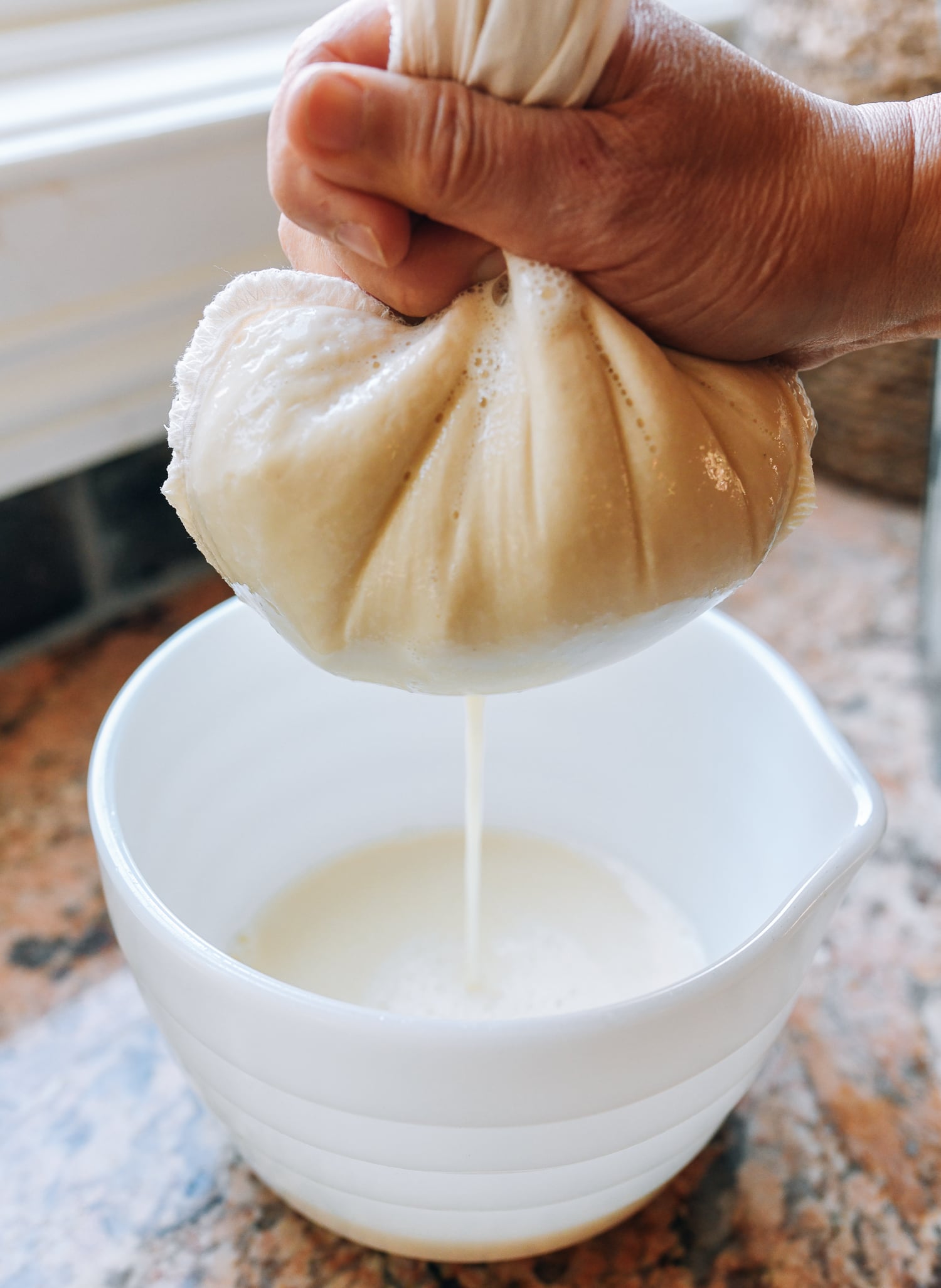squeezing liquid out of chickpea pulp