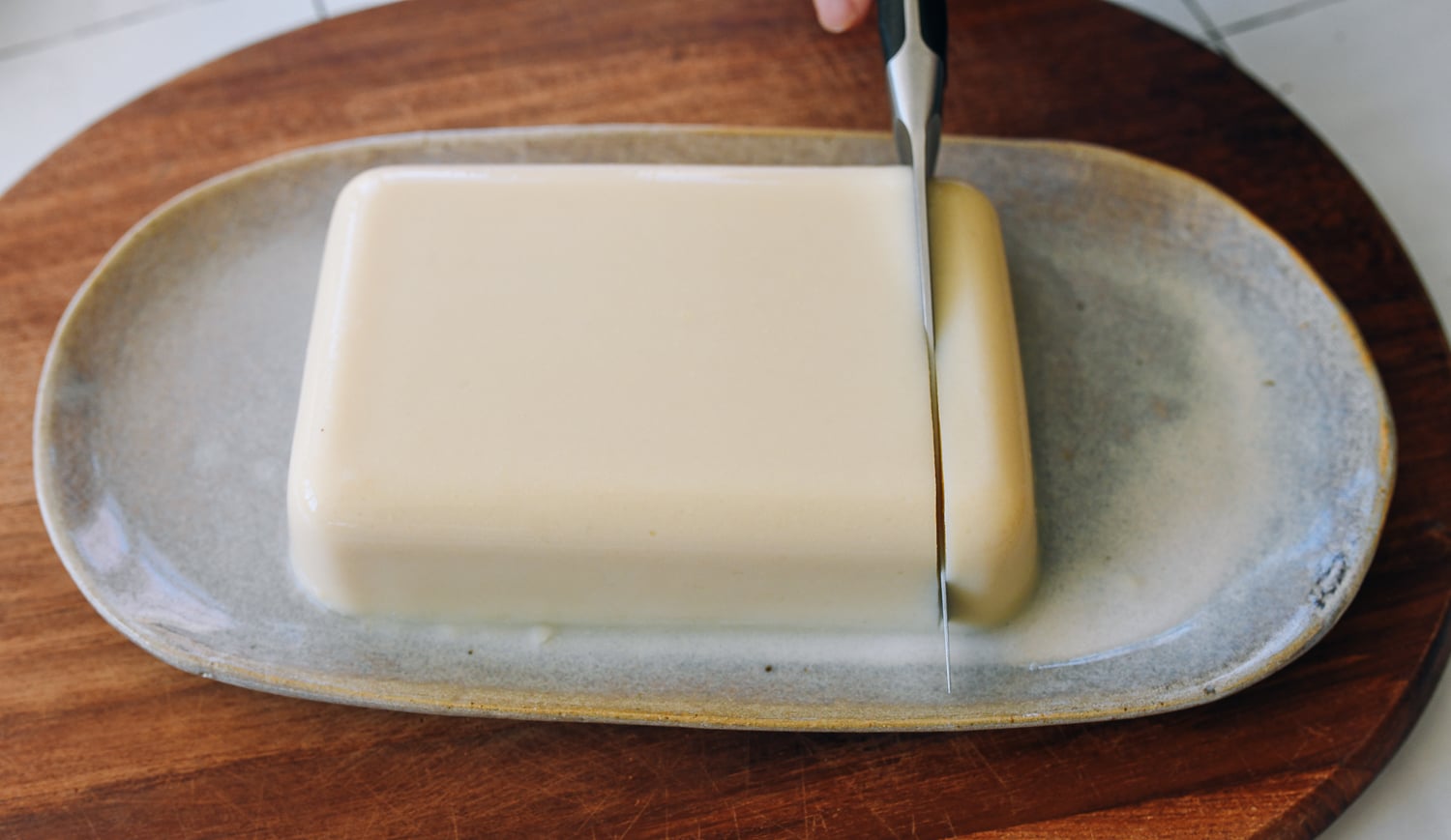 slicing chickpea tofu