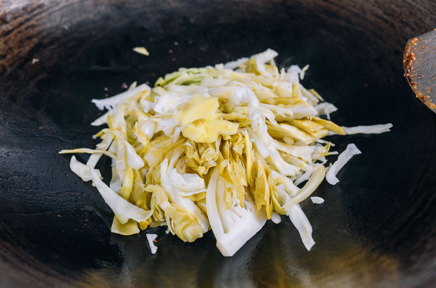 sliced pickled cabbage in wok