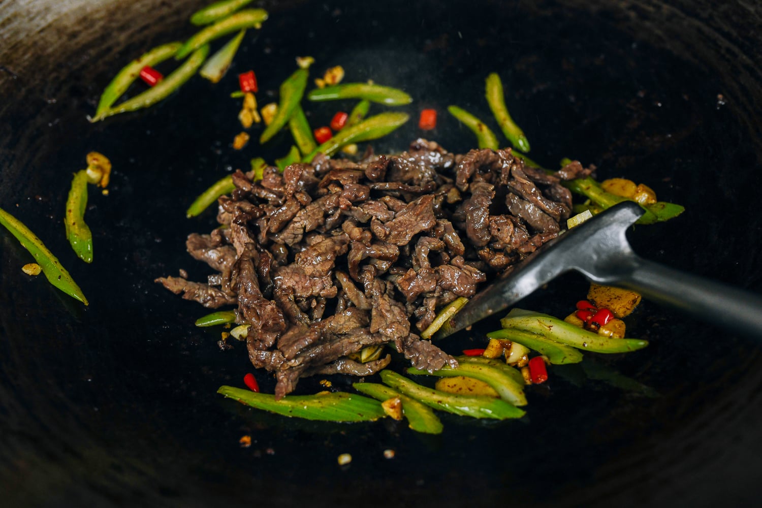 beef added back to vegetables in wok