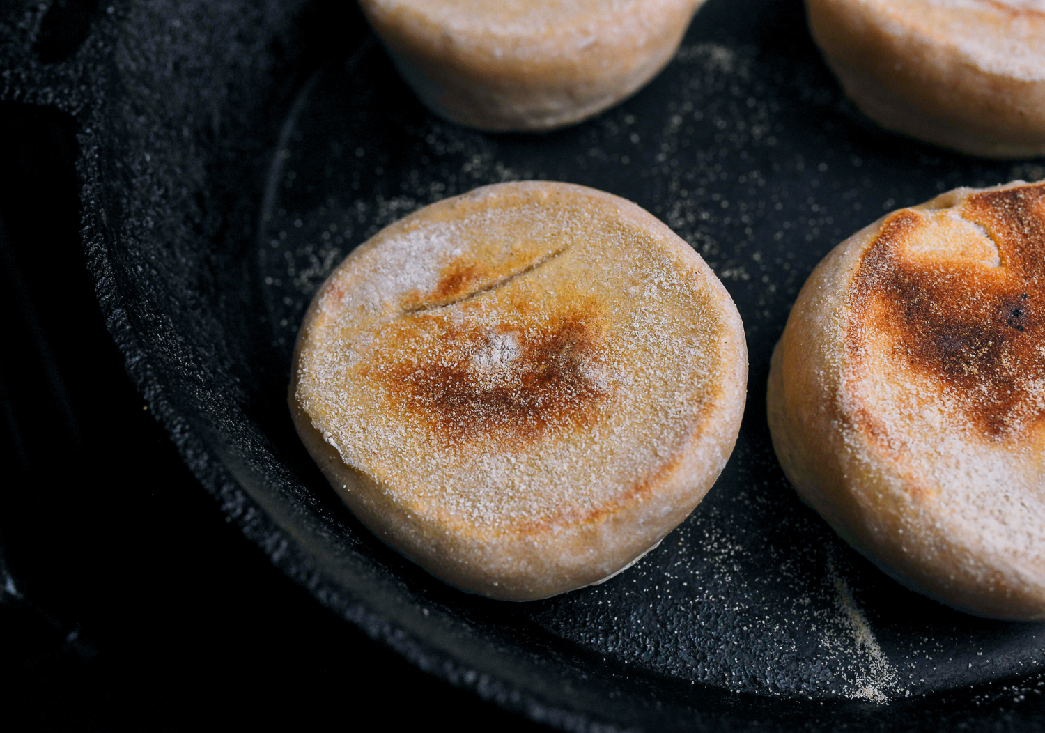 cooked english muffins in  cast iron skillet