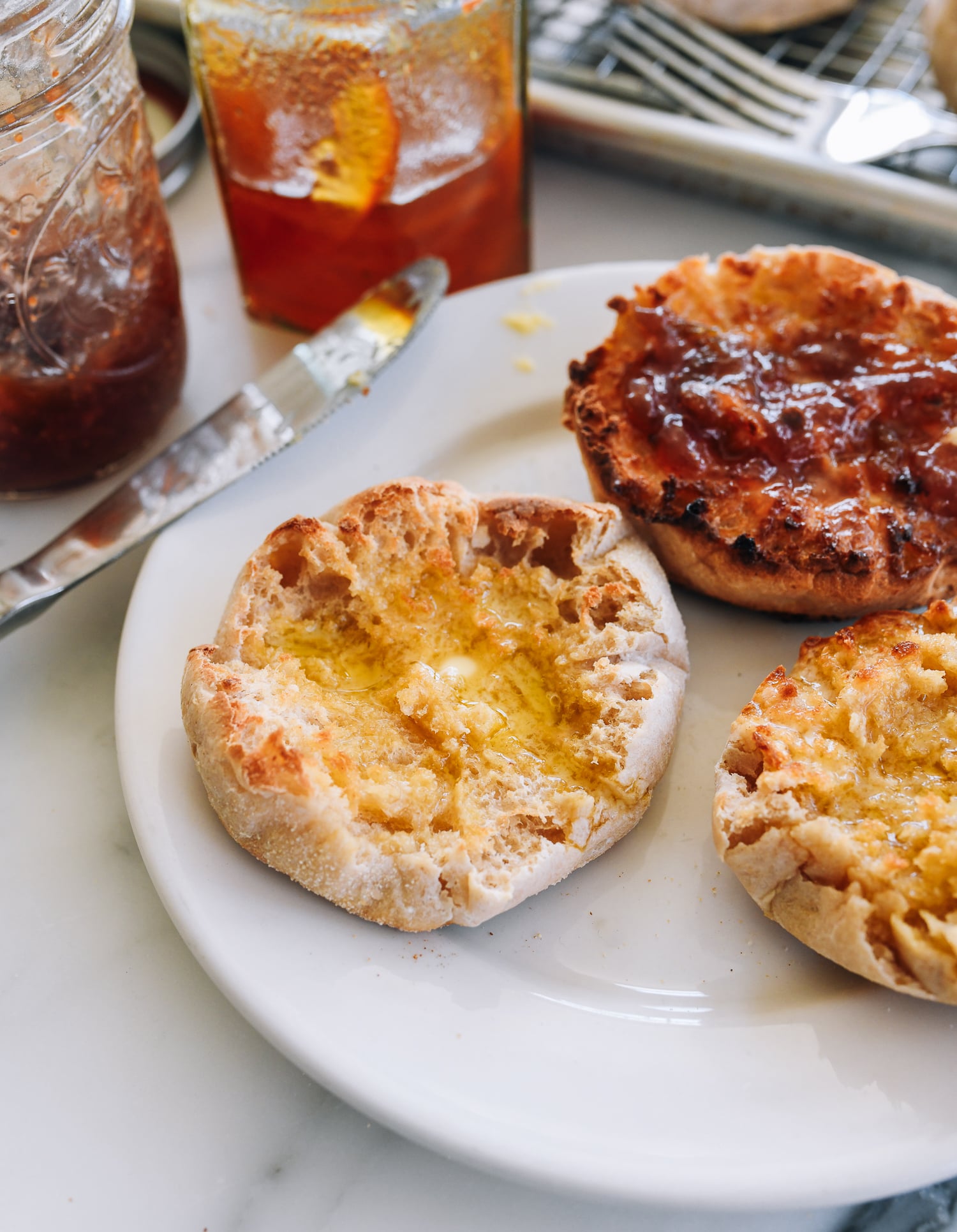 Sourdough english muffin with butter and jam
