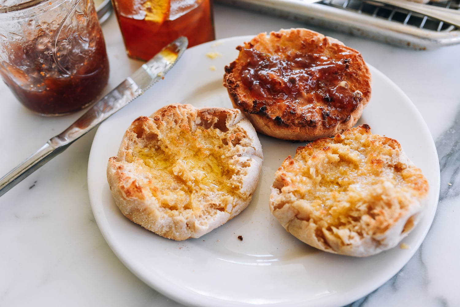 sourdough english muffins toasted with butter and fig jam