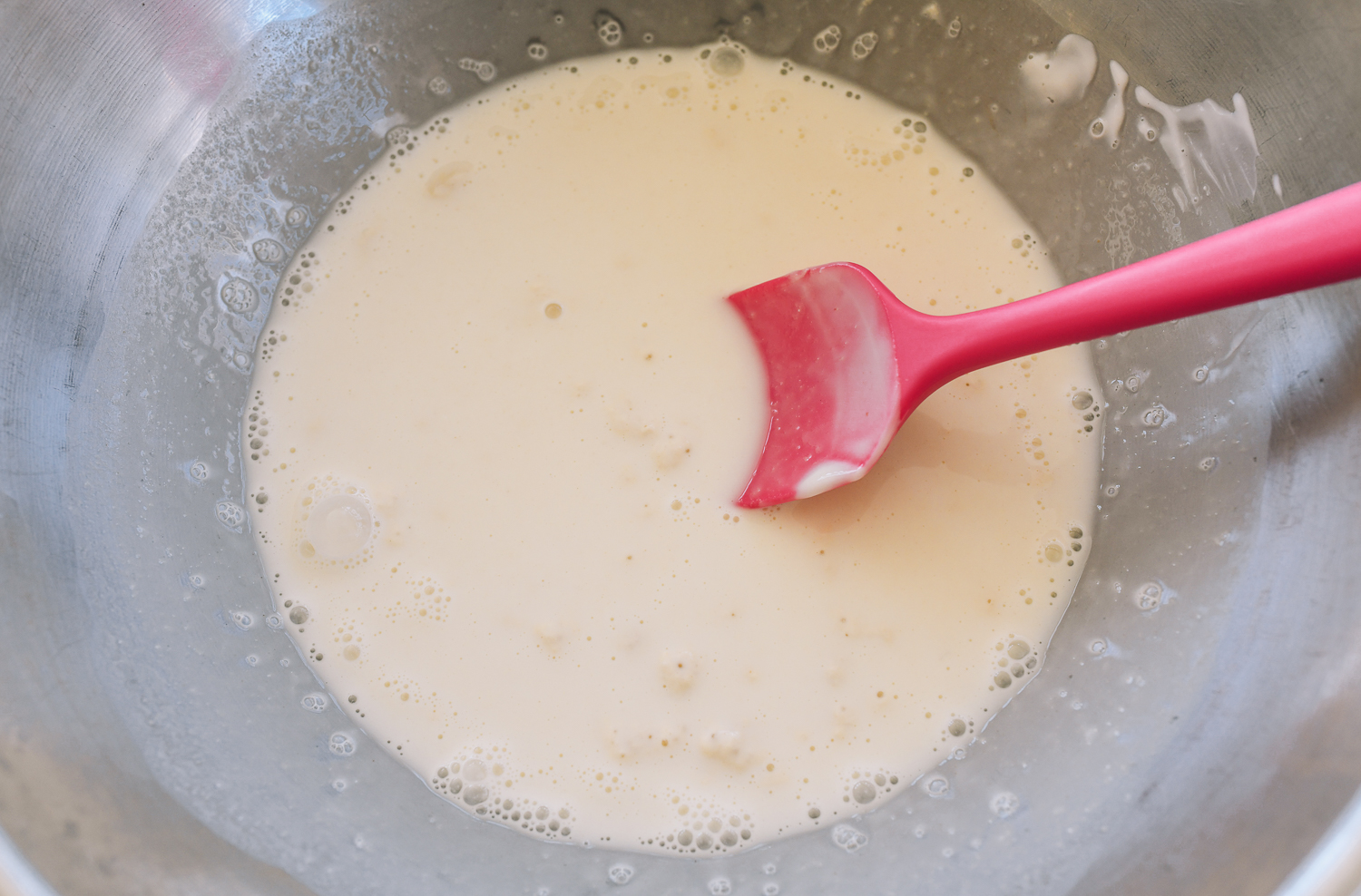 mixed wet ingredients in metal bowl
