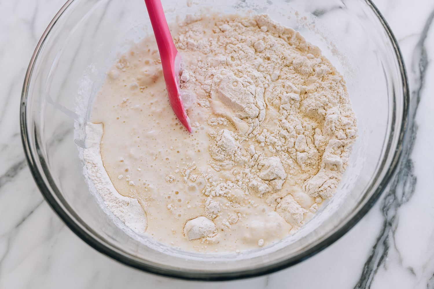 mixing wet and dry ingredients for sourdough english muffins